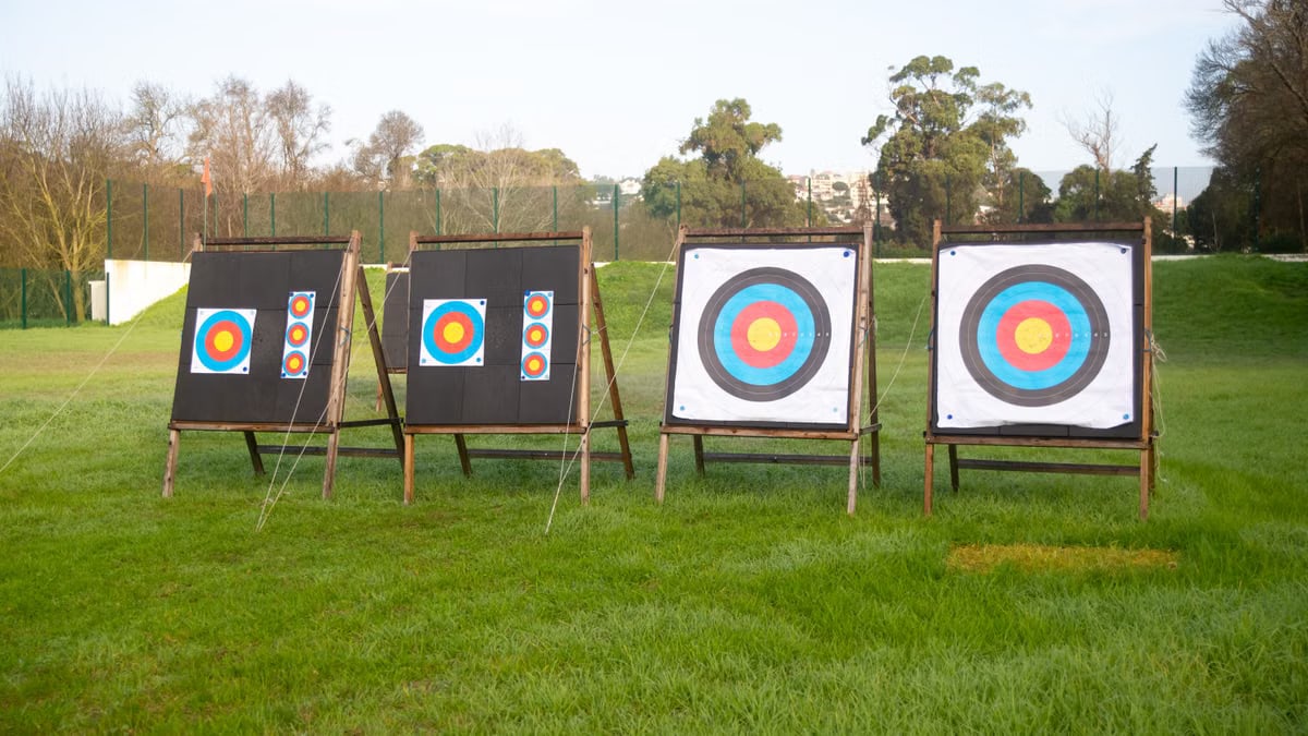 Outdoor archery targets on a grassy field in Portugal, ideal for sports practice.